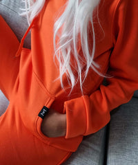 Orange hoodie Australian fashion designer. fashion week in a hoodie. Misha world hoodie. casual stay home. til Tok trends. work from home outfit. after pay available in madola the label.